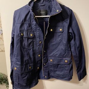 Jcrew navy rain jacket. Not sure I’ve ever worn it. Like new
